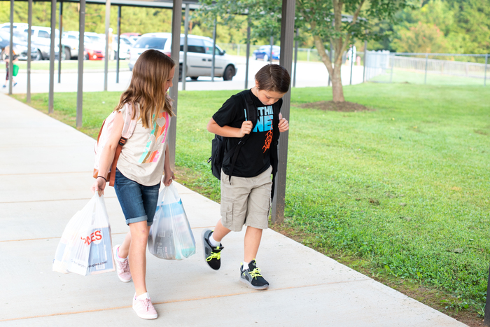 Students at Starr Elementary walk in on the first day.